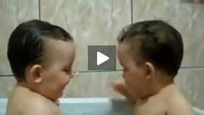 Twins Brothers Enjoying Bath Time