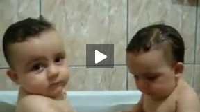 Twins Brothers Enjoying Bath Time